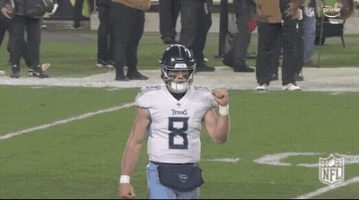 Football Player In Titans Jersey With Fist In Air GIF