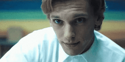 Football Player In White And Blue Uniform Flexing GIF