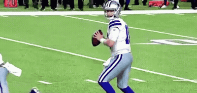 Football Player In White And Blue Uniform Holding Football GIF