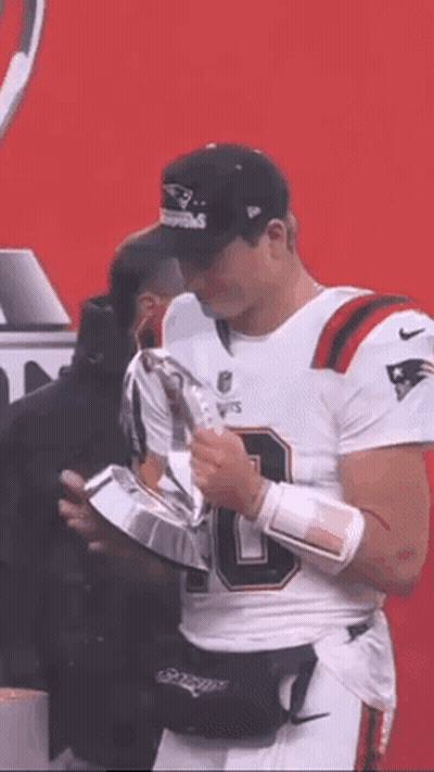 Football Player In White Jersey Holding Trophy GIF