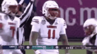 Football Player In White Jersey Number 11 Standing On Field GIF