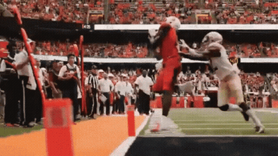 Football Player Jumping Over Fence GIF