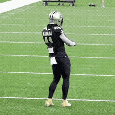 Football Player Kamara Standing On Field GIF