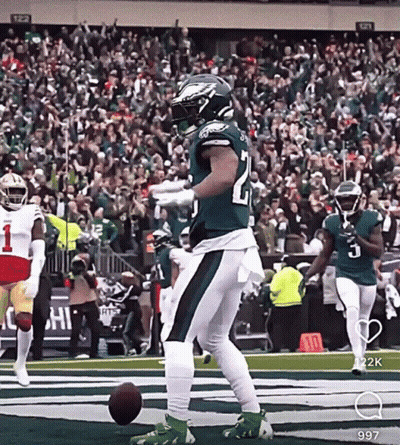 Football Player Kicking Ball In Green And White Uniform GIF
