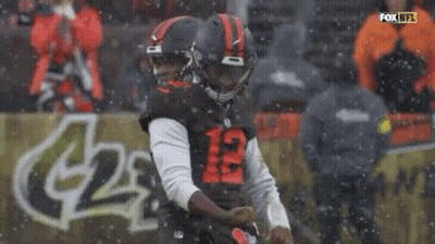 Football Player Kicking Ball In Snow GIF
