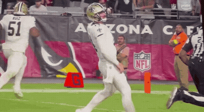 Football Player Kicking Ball With Referee Watching GIF