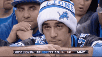 Football Player Kneeling In Crowded Stadium GIF