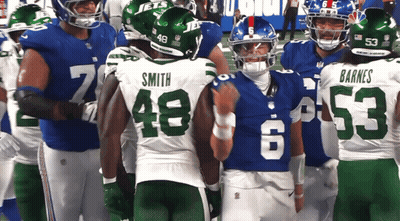 Football Player Kneeling On Field GIF