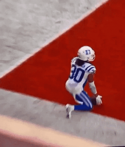 Football Player Kneeling On Field GIF