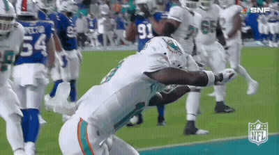 Football Player Kneeling On Field GIF