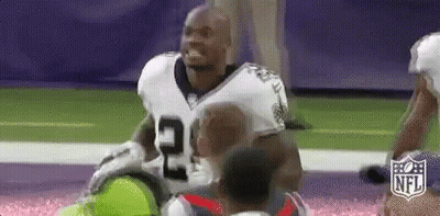 Football Player Kneeling On Field GIF