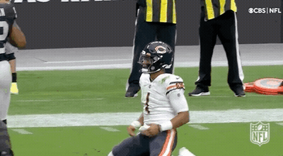 Football Player Kneeling On Field With Referee GIF