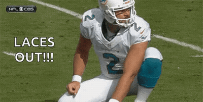 Football Player Kneeling Tying Laces GIF