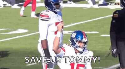 Football Player Kneeling With Player Behind GIF