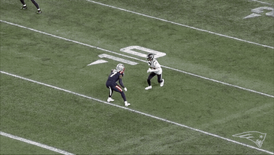 Football Player Laying On Field With Patriots Logo GIF
