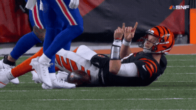 Football Player Laying On Field With SNF Logo GIF