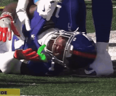 Football Player Laying With Yellow Side Sign GIF