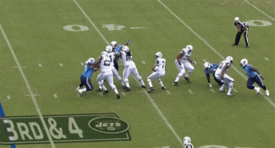 Football Player Leaps Over Sign Saying 3Rd & 4 GIF