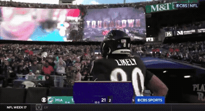 Football Player Likely Standing Before Large Screen GIF