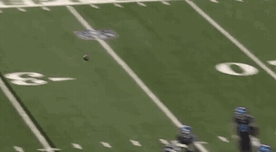 Football Player Lying On Field Referee Watching GIF