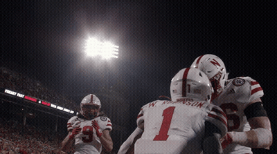 Football Player Number 1 Hugging Another Player GIF
