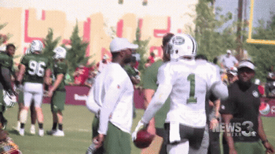 Football Player Number 1 Talking To Another GIF
