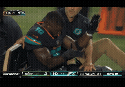 Football Player Number 10 Being Helped GIF