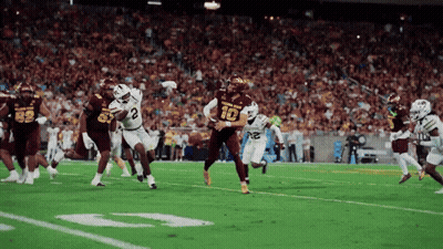 Football Player Number 10 Being Tackled GIF