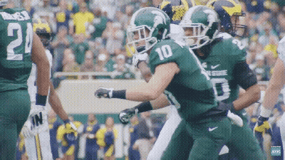 Football Player Number 10 Being Tackled GIF