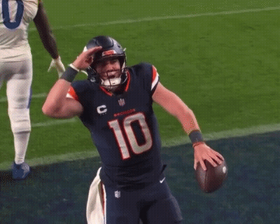 Football Player Number 10 Holding Football