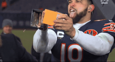 Football Player Number 10 Holding Something GIF