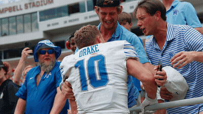 Football Player Number 10 Hugged By Fans GIF