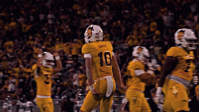 Football Player Number 10 Jersey Being Tackled GIF
