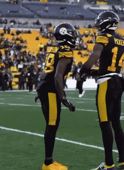 Football Player Number 10 Jersey Talking To Another Player GIF