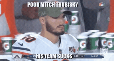 Football Player Number 10 Sitting In Front Of Gatorade Cans GIF