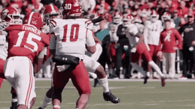 Football Player Number 10 Tackled GIF