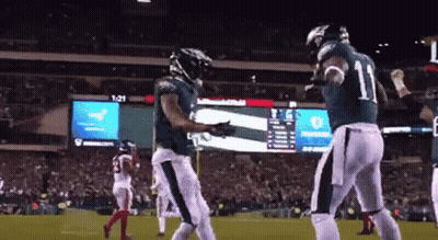 Football Player Number 11 Celebrating With Teammate GIF