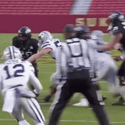 Football Player Number 12 Being Tackled GIF