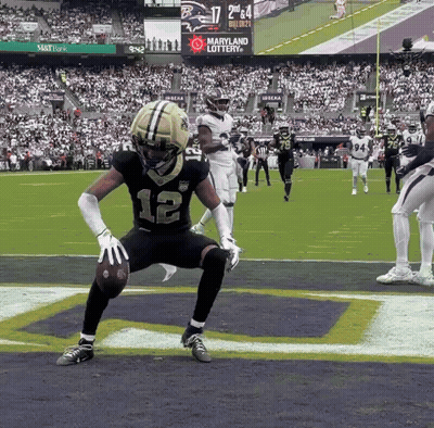 Football Player Number 12 Holding Ball