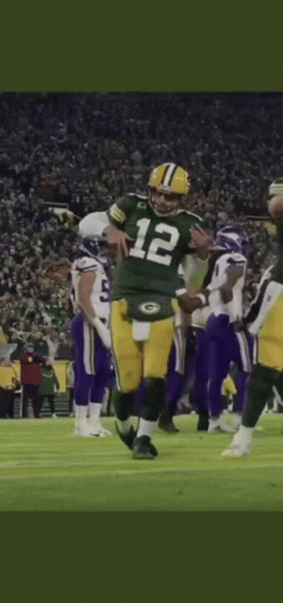 Football Player Number 12 Kneeling on Field