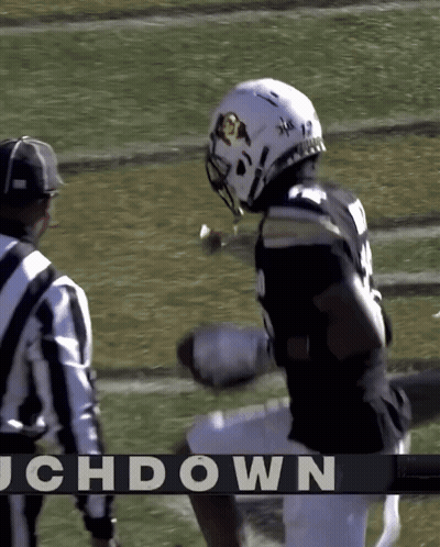 Football Player Number 12 Next To Referee GIF