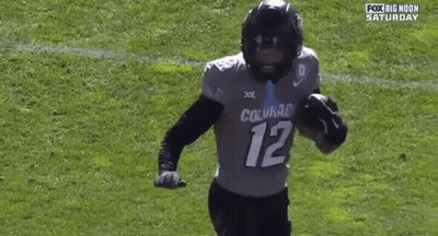 Football Player Number 12 Running On Field GIF