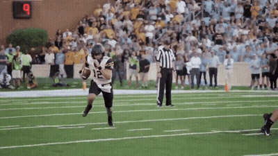 Football Player Number 12 Running With Ball GIF