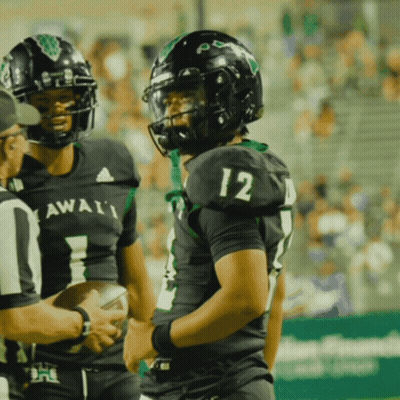 Football Player Number 12 Talking To Referee GIF