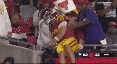 Football Player Number 13 Held By Fan GIF