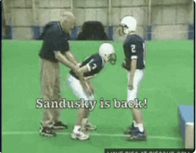 Football Player Number 13 Helped By Coach GIF