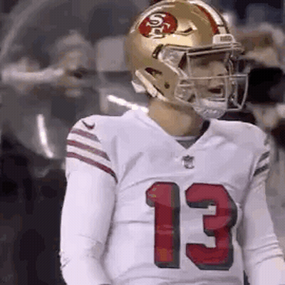 Football Player Number 13 In Helmet And Jersey GIF