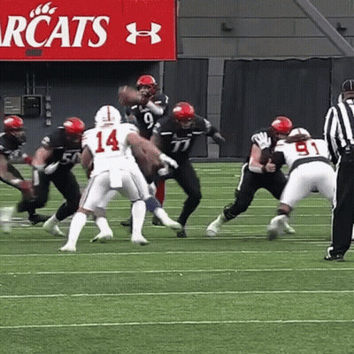 Football Player Number 14 Being Tackled GIF