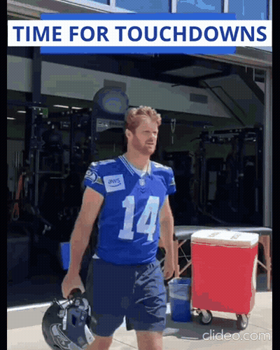 Football Player Number 14 Carrying Helmet GIF