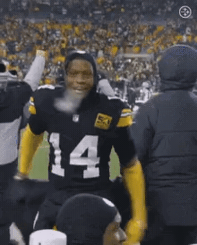 Football Player Number 14 Standing In Front Of Crowd GIF